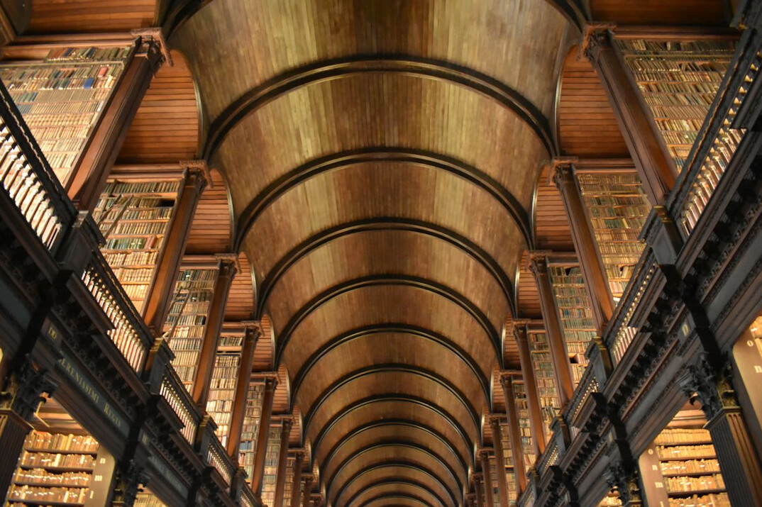 Old library with tall shelves full of books